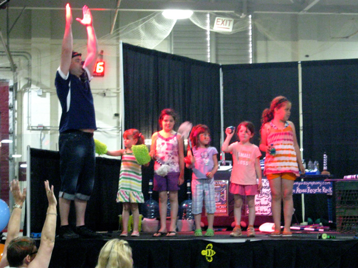 Jonny prompts the cheerleader to cheer.