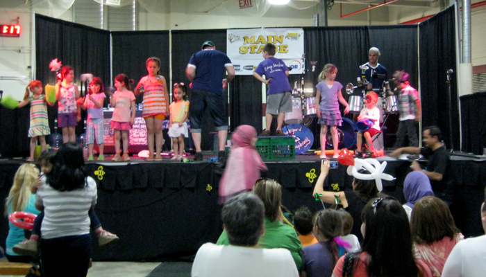 Jonny shows a boy how to dance.