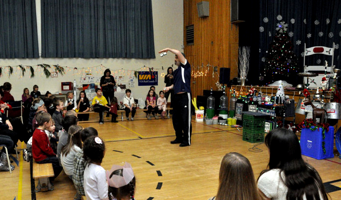 Jonny juggles tennis balls.