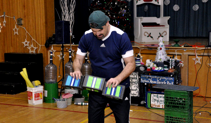 Jonny performs a cigar box routine.