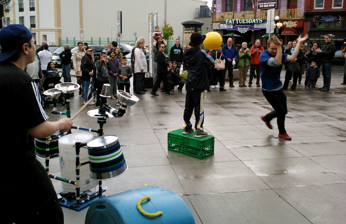 A vonunteer balances a ball.