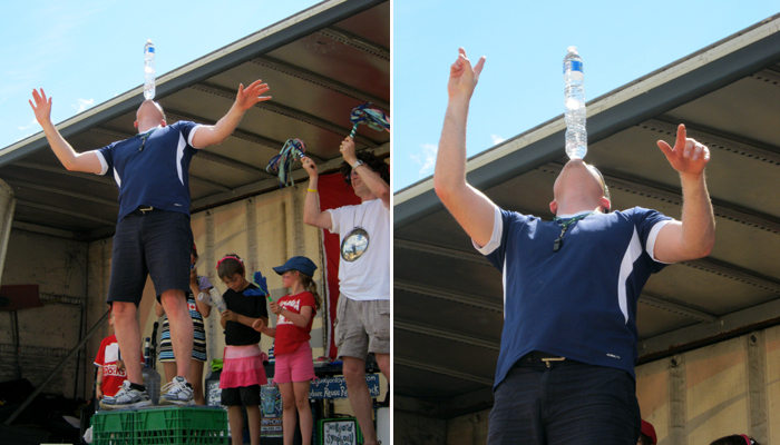 Junkyard Jonny balances two water bottles while drinking.