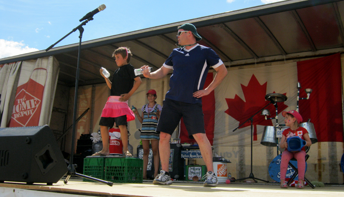 Junkyard Jonny shows a boy how to dance like a girl.