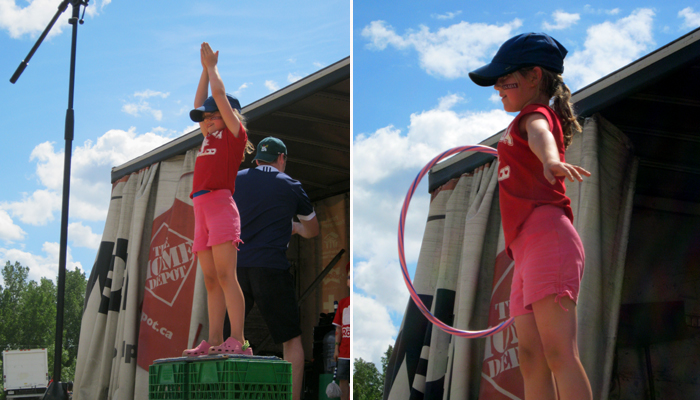 A girl learns to hoola-hoop.